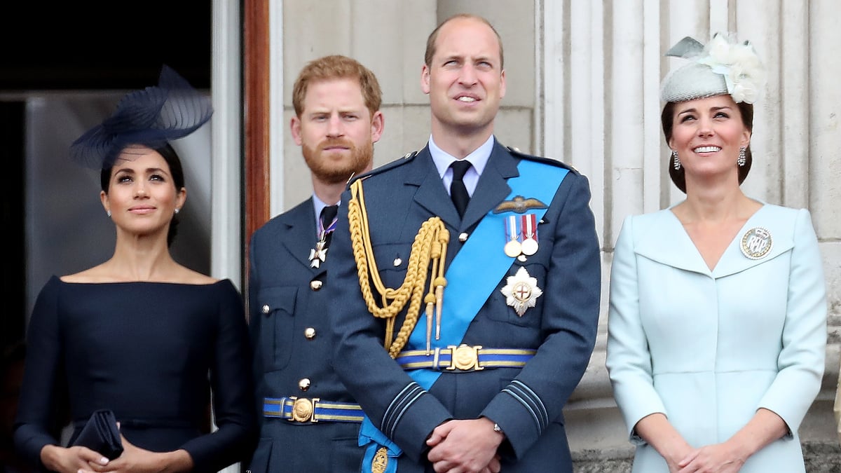 (L-R) Meghan, Duchess of Sussex, Prince Harry, Duke of Sussex, Prince William, Duke of Cambridge and Catherine, Duchess of Cambridge watch the RAF flypast on the balcony of Buckingham Palace, as members of the Royal Family attend events to mark the centenary of the RAF on July 10, 2018 in London, England.