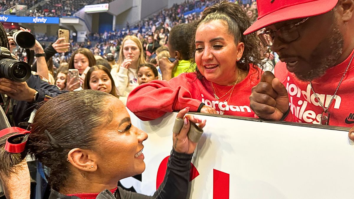 Jordan Chiles is congratulated by her parents Timothy and Gina Chiles after her performance during the 2024 Core Hydration Gymnastics Classic at the XL Centre, Hartford on May 18th, 2024, in Hartford, Connecticut. USA.