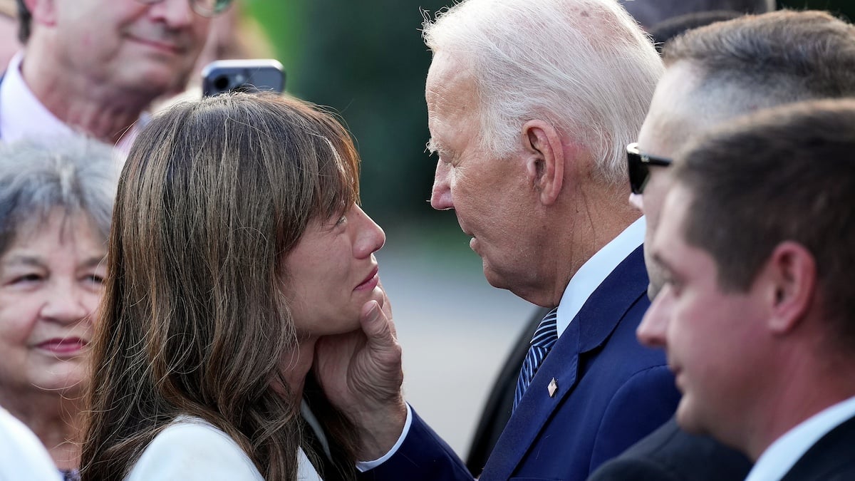 WASHINGTON, DC - SEPTEMBER 12: U.S. President Joe Biden comforts Lesleu Hu, whose 9-year-old son was killed by her ex-husband, during an event ahead of the 30th anniversary of the Violence Against Women Act on the South Lawn of the White House on September 12, 2024 in Washington, DC. Biden invited survivors, advocates, and former aides to celebrate the legislation he helped enact as a U.S. senator along with highlighting his administration’s new protection measures to protect women.