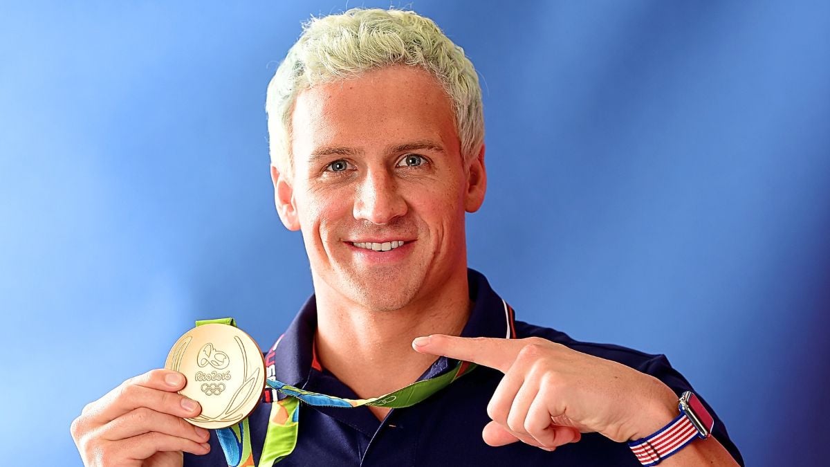 Swimmer, Ryan Lochte of the United States poses for a photo with his gold medal on the Today show set on Copacabana Beach on August 12, 2016 in Rio de Janeiro, Brazil.