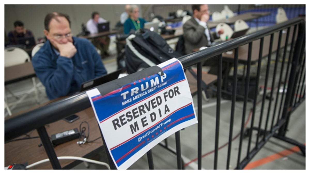 Memebers of the news media file stories and pictures from the press pen following a rally with Republican presidential candidate Donald Trump at Macomb Community College on March 4, 2016 in Warren, Michigan. Voters in Michigan will go to the polls March 8 for the State's primary