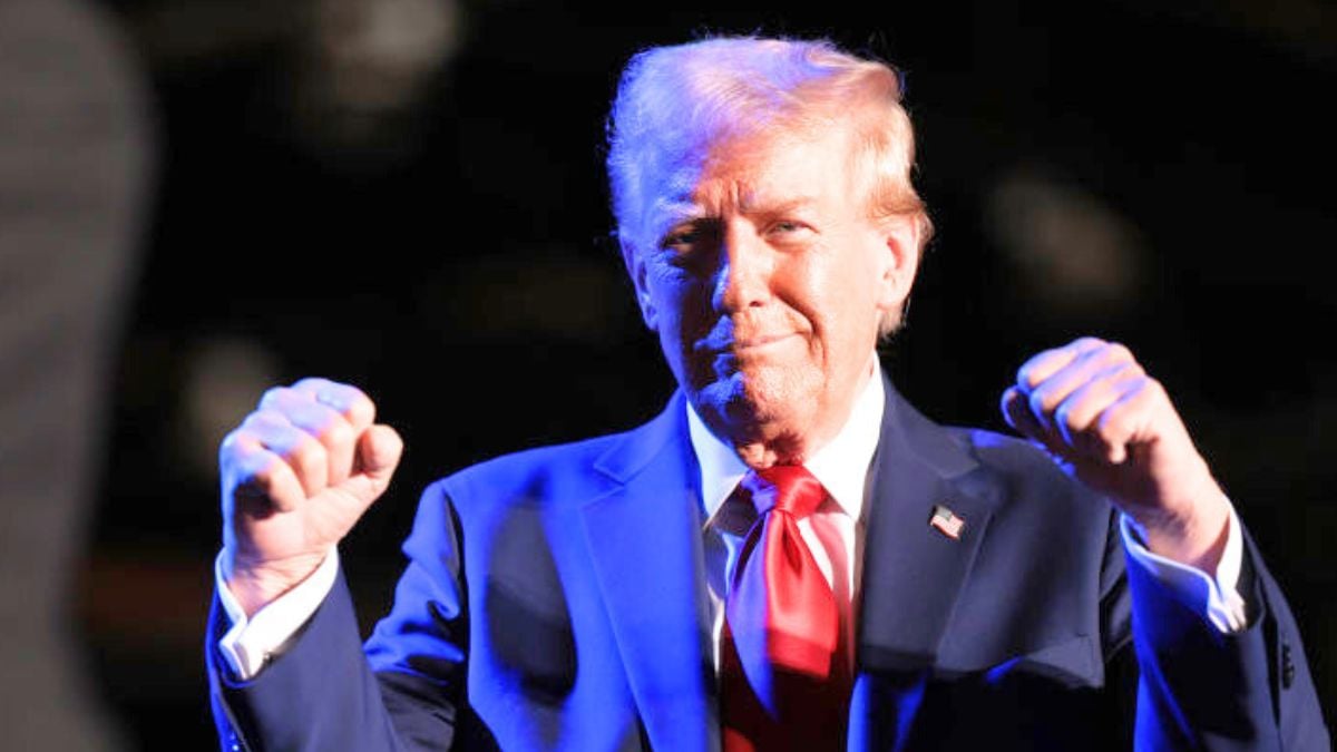 DETROIT, MICHIGAN - OCTOBER 18: Republican presidential nominee, former U.S. President Donald Trump, greets Tommy "Hitman" Hearns during a campaign rally on October 18, 2024, in Detroit, Michigan. There are 17 days remaining until the U.S. presidential election, which will take place on Tuesday, November 5, 2024. (Photo by Win McNamee/Getty Images)