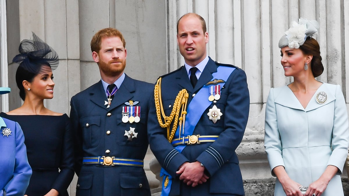 LONDON, UNITED KINGDOM - JULY 1O: Meghan, Duchess of Sussex, Prince Harry, Duke of Sussex, Prince William, Duke of Cambridge and Catherine, Duchess of Cambridge stand on the balcony of Buckingham Palace to view a flypast to mark the centenary of the Royal Air Force (RAF) on July 10, 2018 in London, England.