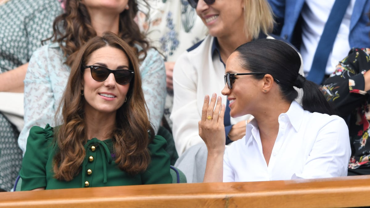 LONDON, ENGLAND - JULY 13: Catherine, Duchess of Cambridge and Meghan, Duchess of Sussex in the Royal Box on Centre Court during day twelve of the Wimbledon Tennis Championships at All England Lawn Tennis and Croquet Club on July 13, 2019 in London, England.