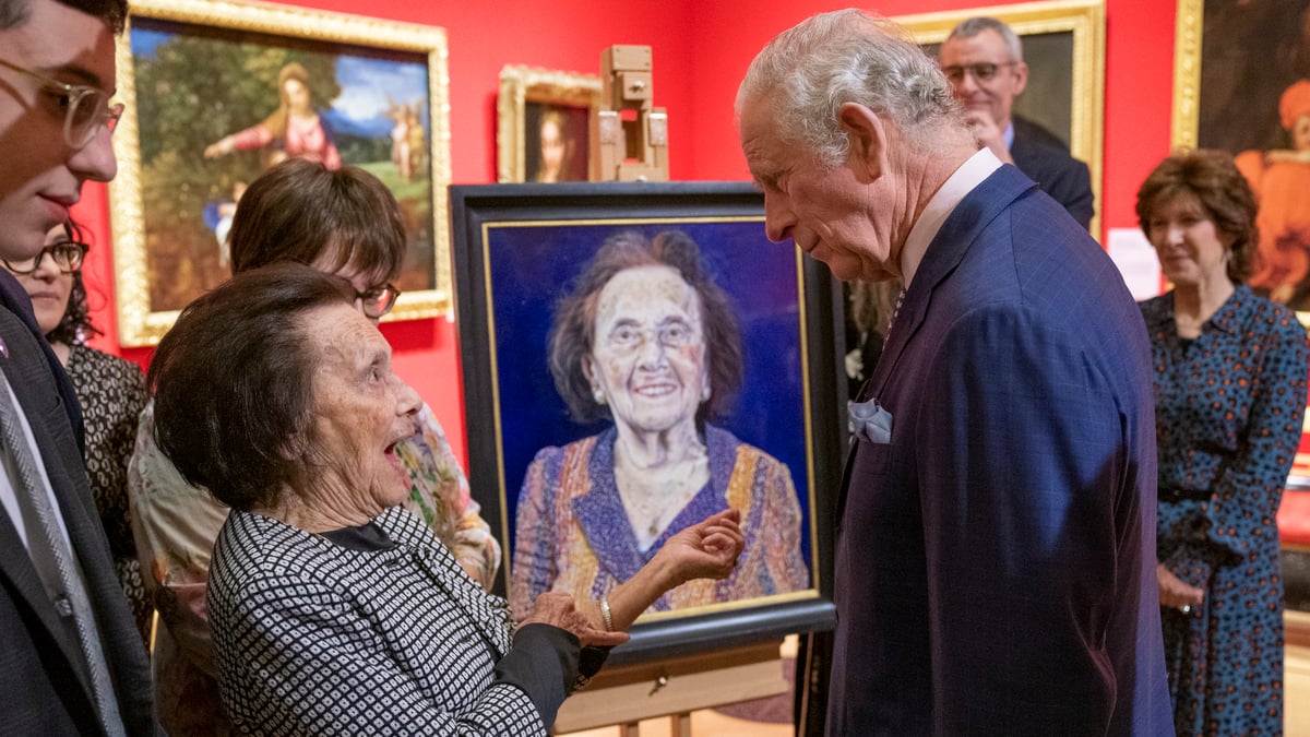 LONDON, ENGLAND - JANUARY 24:  Prince Charles, Prince of Wales speaks with with survivor Lily Ebert at an exhibition of Seven Portraits: Surviving the Holocaust, which were commissioned by Prince Charles, Prince of Wales to pay tribute to Holocaust survivors, at The Queens Gallery, Buckingham Palace on January 24, 2022 in London, England. 