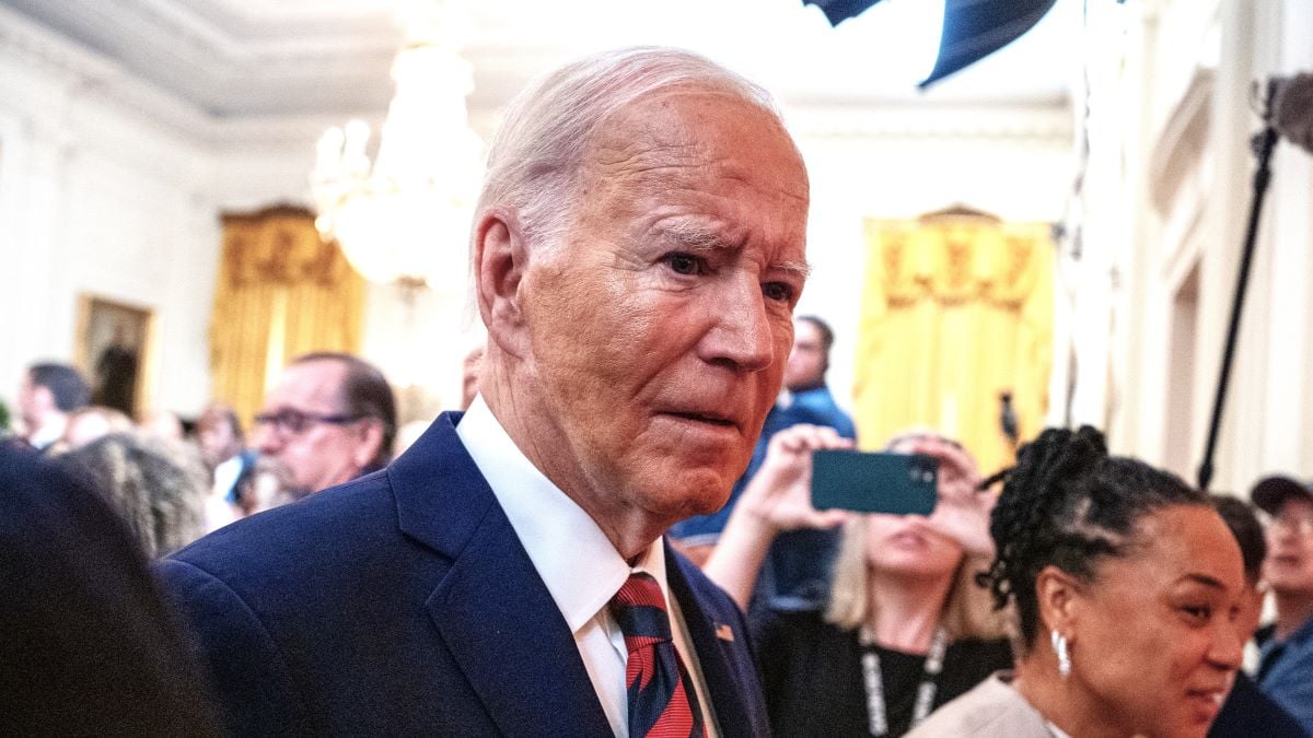 U.S. President Joe Biden listens to reporter's questions as he and South Carolina Gamecocks Head Coach Dawn Staley (R) depart an event to celebrate the 2023-2024 University of South Carolina Gamecocks Women's Basketball NCAA championship team in the East Room at the White House on September 10, 2024 in Washington, DC. The Gamecocks ended their season undefeated and beat the Iowa Hawkeyes 87-75 for their third NCAA Championship with Head Coach Dawn Staley. (Photo by Andrew Harnik/Getty Images)