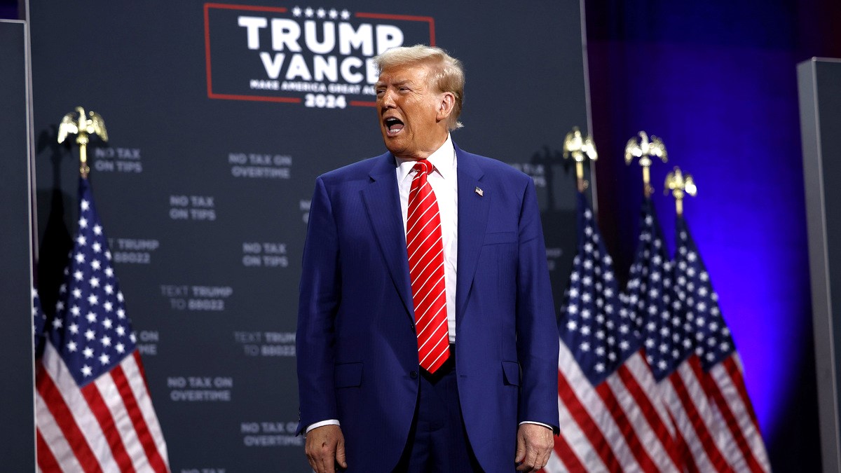 Republican presidential nominee, former U.S. President Donald Trump arrives to campaign rally at the Cobb Energy Performing Arts Centre on October 15, 2024 in Atlanta, Georgia. With early voting starting today in Georgia both Trump and Democratic presidential nominee, Vice President Kamala Harris are campaigning in the Atlanta region this week as polls show a tight race.