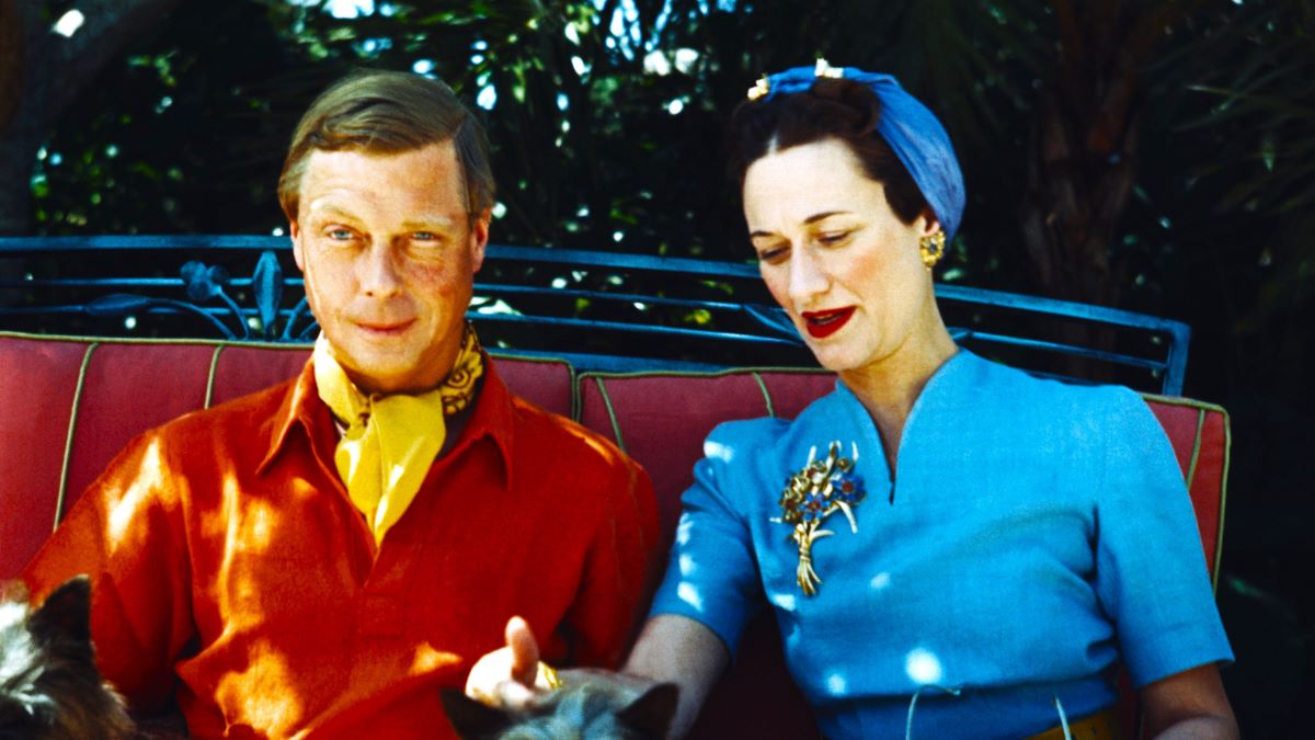 The Duke and Duchess of Windsor seated outdoors with two small dogs. (Photo by Bettmann via Getty Images)