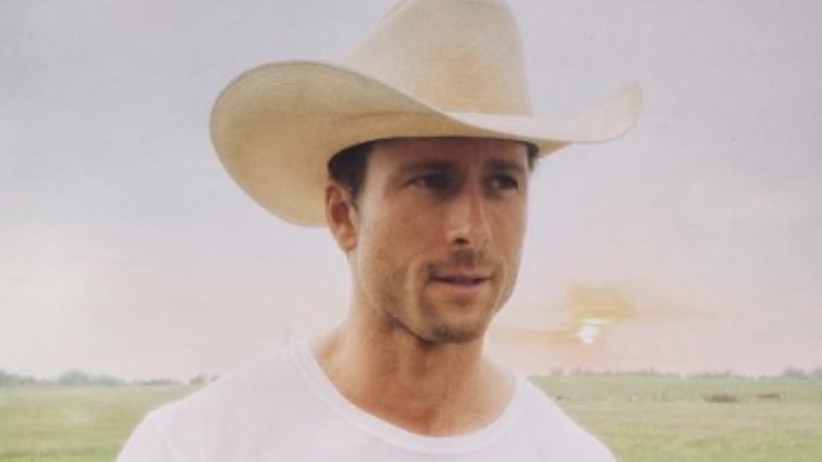 Glen Powell wearing stetson on set of Twisters