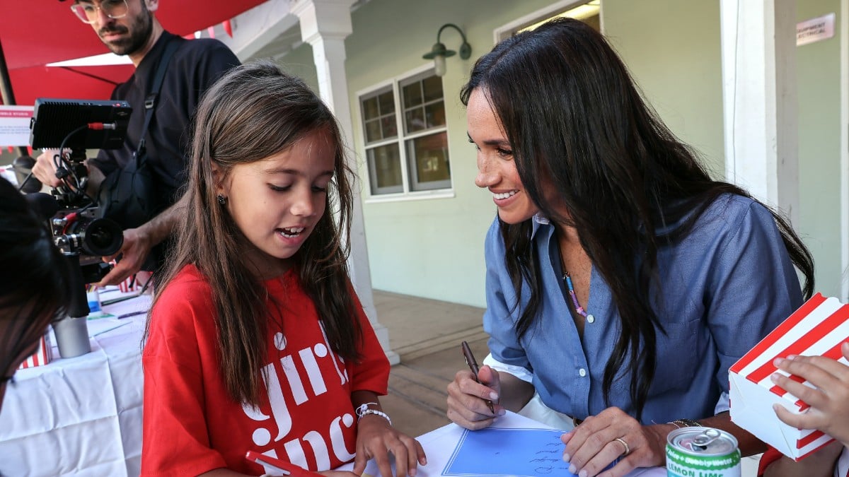 Meghan Markle speaks with young girl during visit to Girls Inc. of Greater Santa Barbara