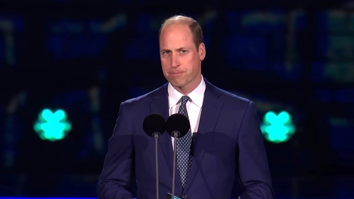 Prince William wearing a suit and speaking