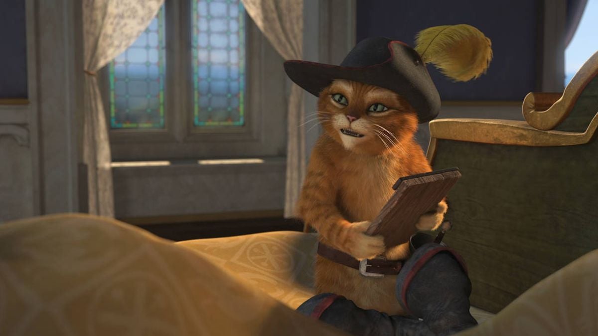 Puss in Boots reading a book in Shrek