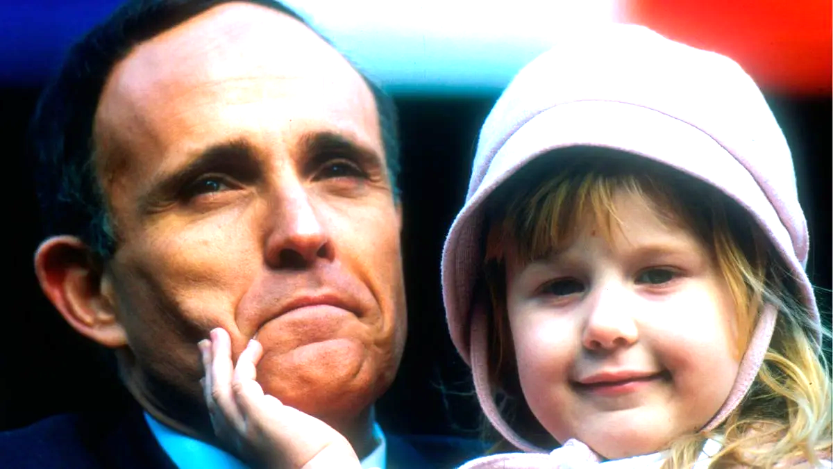 Rudolph Giuliani holds his daughter Caroline during his swearing in ceremony