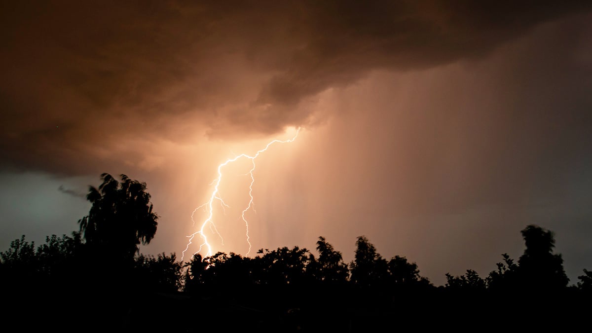 A bolt of lighting lights a night sky