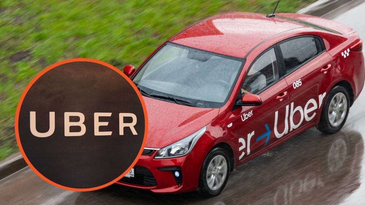 Uber logo and Uber car driving