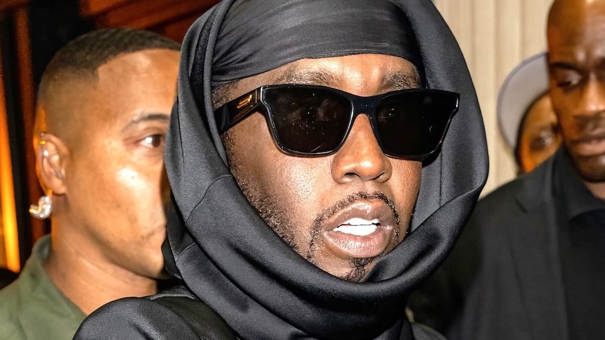 Diddy wearing black sunglasses and a black head wrap at the 2023 VMAs