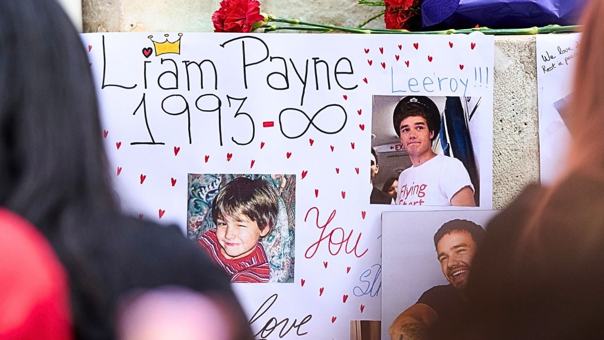 Photos of Liam Payne are seen during a memorial gathering at Santa Ana Square on October 20, 2024 in Madrid, Spain. According to the Buenos Aires police department, Payne fell from a third-floor hotel room balcony in Palermo, a famous neighborhood in Buenos Aires. Fans around the city gather to pay tribute to the former member of boy band One Direction.