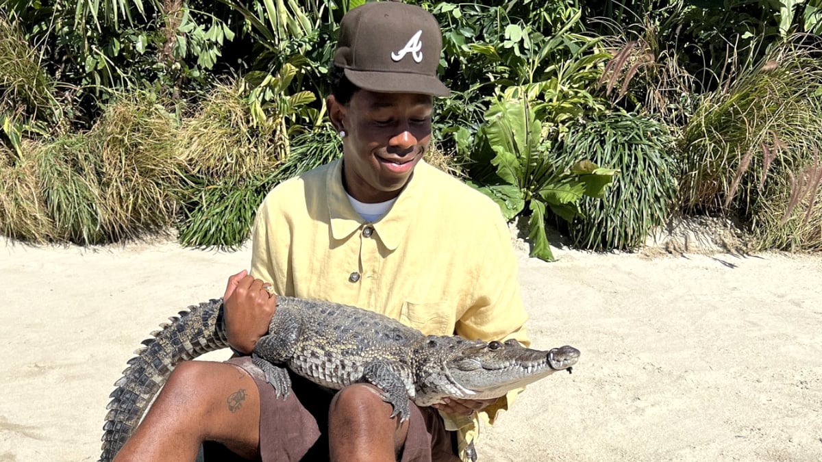 Tyler, the Creator with an alligator