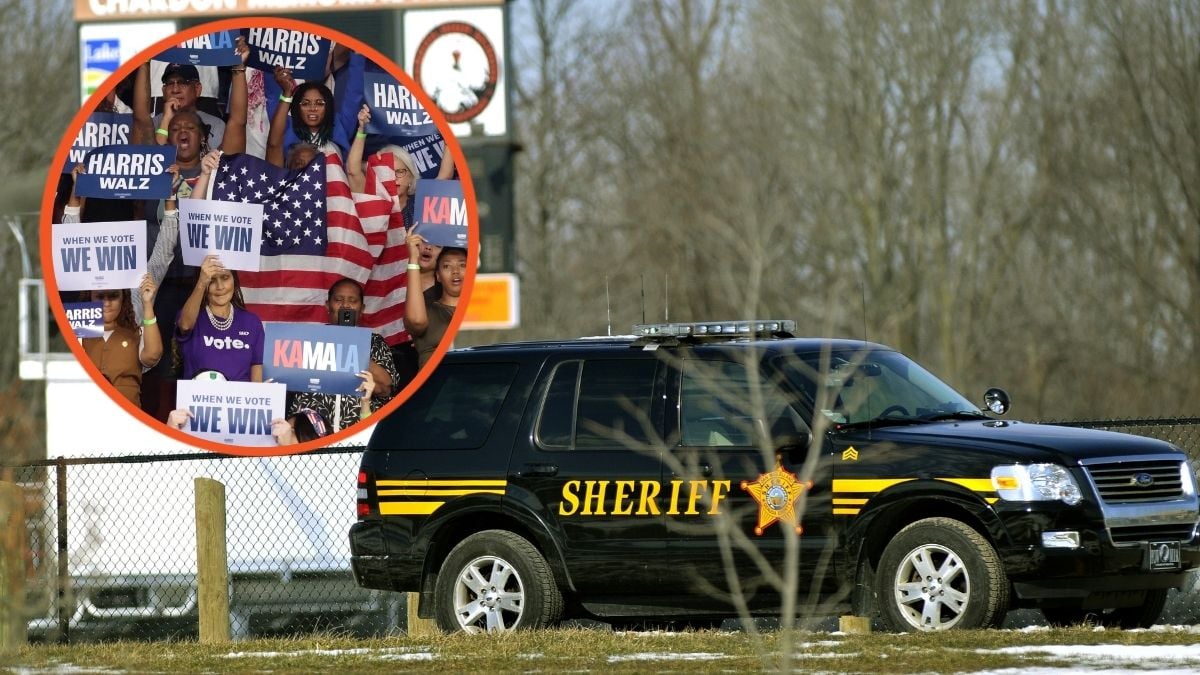 A Sheriff deputy's vehicle and Supporters hold signs at campaign rally for Vice President Kamala Harris