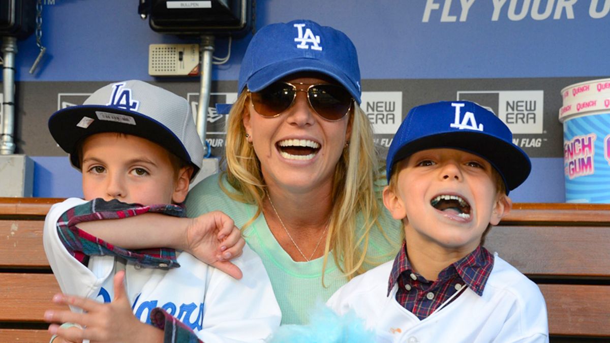 Britney Spears poses with sons Sean Preston Federline (L) and Jayden James Federline (R) during agame against the San Diego Padres at Dodger Stadium