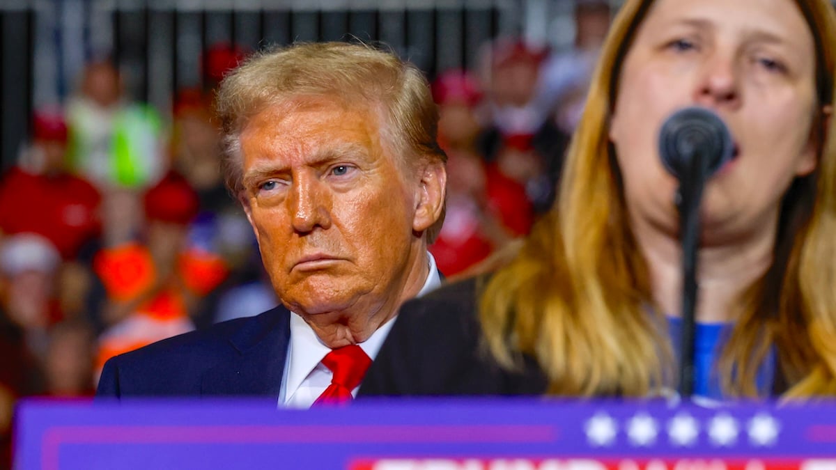 Tammy Nobles speaks as Republican presidential nominee, former President Donald Trump, listens during a campaign rally