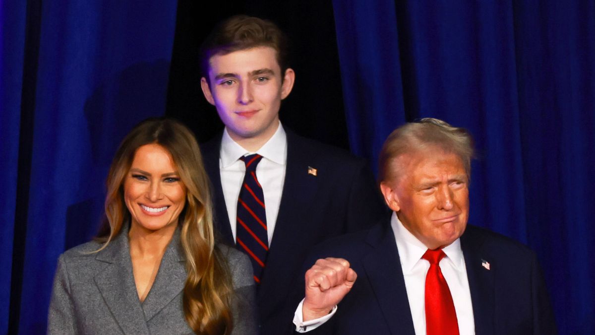 Donald Trump arrives to speak with former first lady Melania Trump and Barron Trump during an election night event