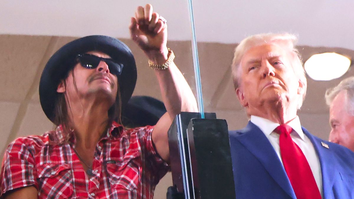 Donald Trump, watches the Alabama Crimson Tide versus Georgia Bulldogs college football game with musician Kid Rock