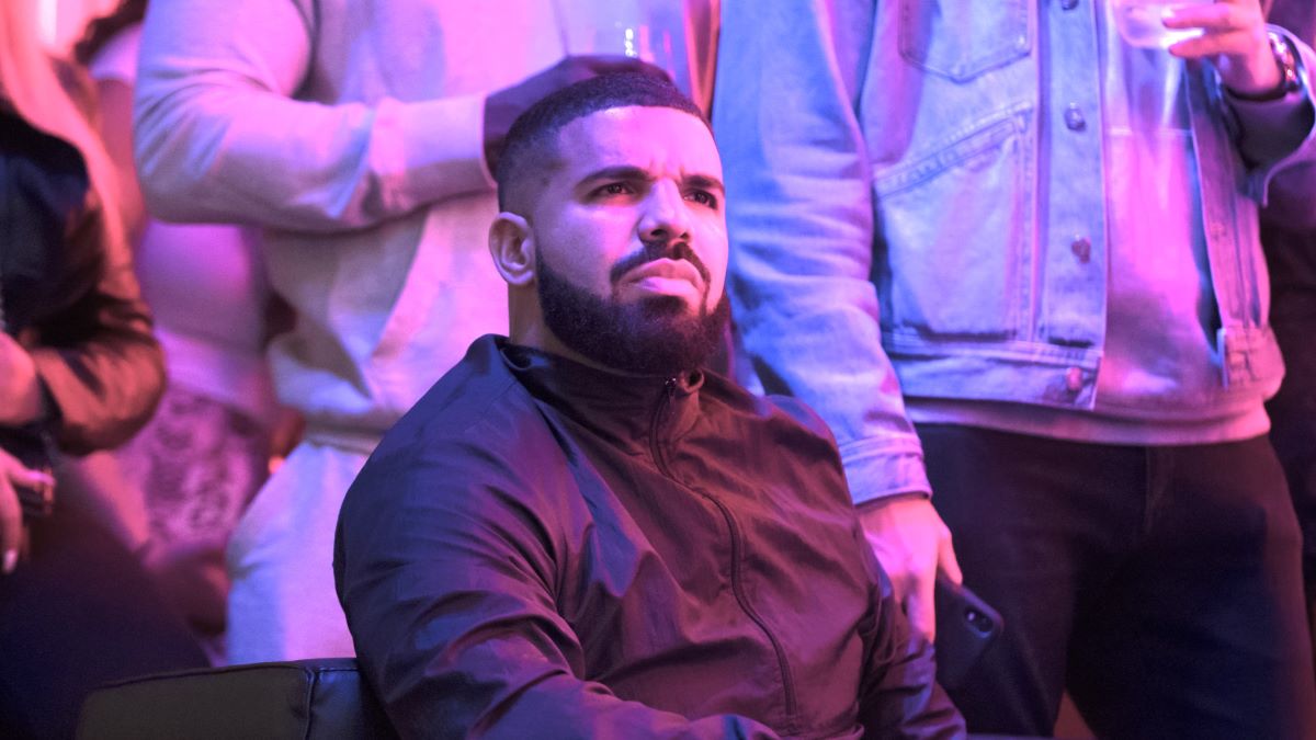 Toronto rapper Drake watches a screen alongside other Toronto Raptors fans as they gather to watch Game Six of the NBA Finals outside of Scotiabank Arena on June 13, 2019 in Toronto, Canada. (Photo by Cole Burston/Getty Images)