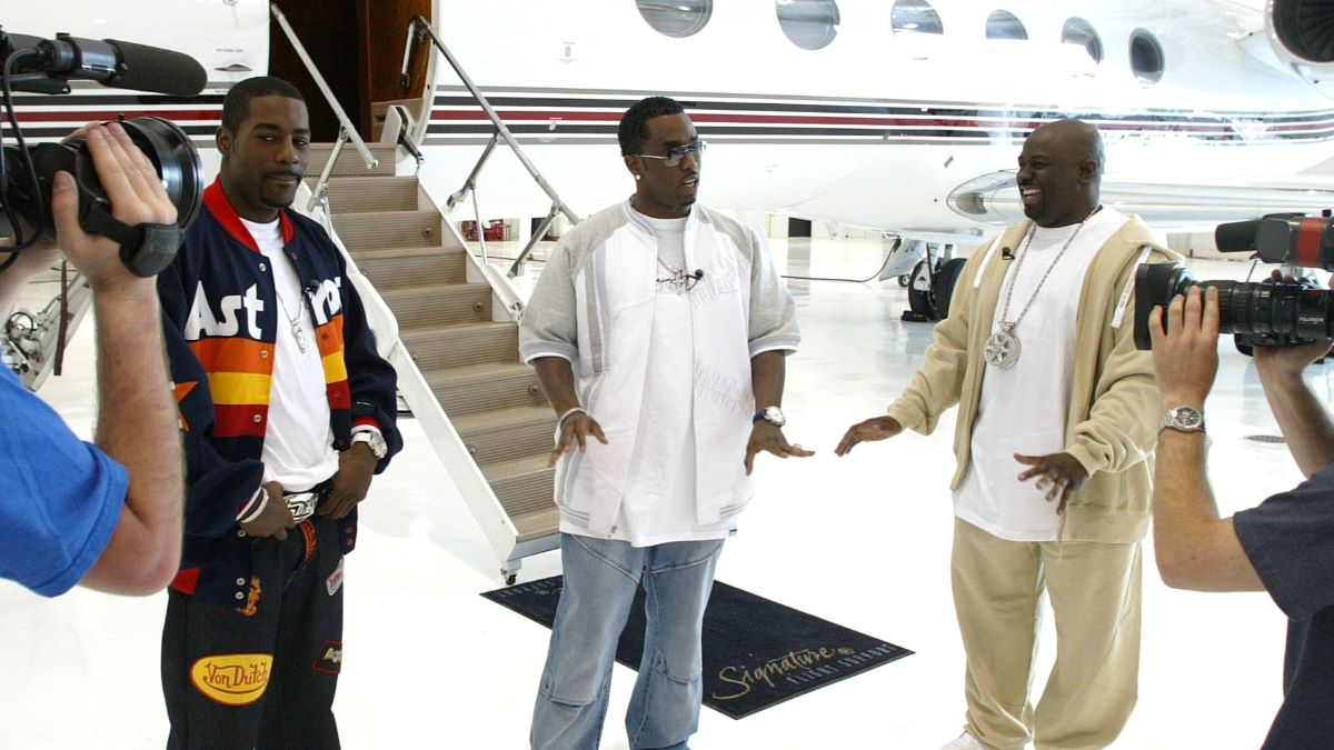 Loon, P. Diddy and Funkmaster Flex appear on a new television program that showcases the cars of celebrities and is called "Ride with Funkmaster Flex" May 16, 2003 in Morristown, New Jersey. This segment is being taped on location at the Morristown Airport and features P. Diddy's private airplane and two of his cars. (Photo by TNN via Getty Images)