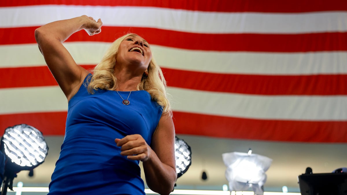 ATLANTA, GEORGIA - AUGUST 03: U.S. Rep. Marjorie Taylor Greene (R-GA) gestures to the crowd before the start of a campaign rally with Republican presidential nominee, former U.S. President Donald Trump and Republican vice presidential nominee U.S. Sen. JD Vance (R-OH) at the Georgia State University Convocation Center on August 03, 2024 in Atlanta, Georgia. Polls currently show a close race between Trump and Democratic presidential candidate, U.S. Vice President Kamala Harris.