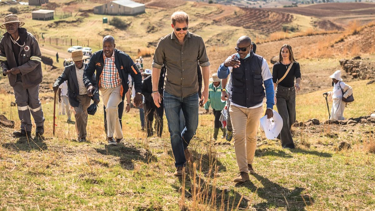 Prince Harry, Duke of Sussex (L) is welcomed by the community leader as he arrives for a visit to Matlameng – Ha Mahlehle in the Leribe region with Sentebale to meet with the community and see the climate resilience project in action on October 2, 2024 in Leribe, Lesotho. Joining the visit, alongside the Co-Founding Patrons Prince Harry, The Duke of Sussex, and Prince Seeiso of Lesotho, and Board Chair Dr. Sophie Chandauka MBE were a group of innovative international funders and business leaders interested in the Southern African region. (Photo by Brian Otieno/Getty Images for Sentebale )