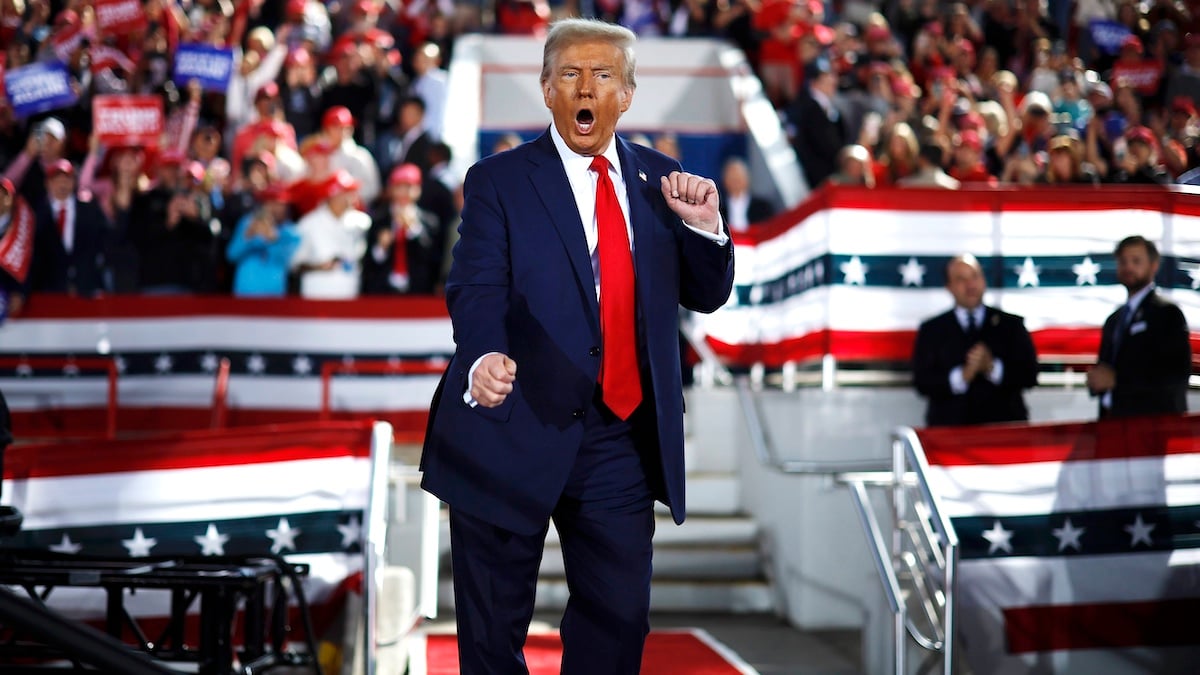 RALEIGH, NORTH CAROLINA - NOVEMBER 04: Republican presidential nominee, former President Donald Trump dances off stage at the conclusion of a campaign rally at the J.S. Dorton Arena on November 04, 2024 in Raleigh, North Carolina. With one day left before the general election, Trump is campaigning for re-election in the battleground states of North Carolina, Pennsylvania and Michigan.