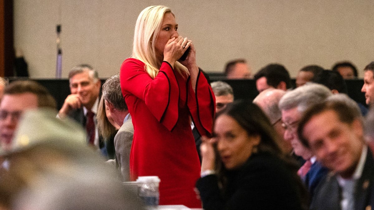 US Rep. Marjorie Taylor-Greene (R-GA) takes a phone call during a House Republicans Conference meeting at the Hyatt Regency on Capitol Hill on November 13, 2024 in Washington, DC. As is tradition with incoming presidents, President-elect Trump is traveling to Washington, DC to meet with U.S. President Joe Biden at the White House as well as Republican members of Congress on Capitol Hill