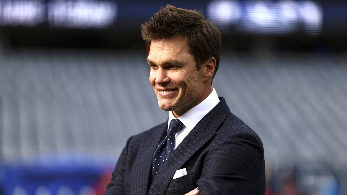 Fox Sports broadcaster Tom Brady smiles on the field prior to an NFL football game between the Chicago Bears and the Green Bay Packers at Soldier Field on November 17, 2024 in Chicago, Illinois