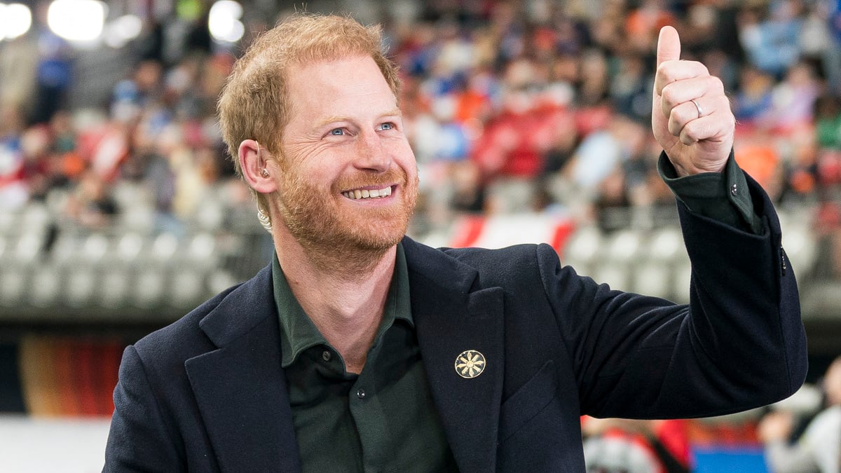 VANCOUVER, CANADA - NOVEMBER 17: Prince Harry acknowledges fans prior to the start of a TV interview during pre-game festivities before the start of the 2024 Grey Cup at BC Place on November 17, 2024 in Vancouver, Canada.