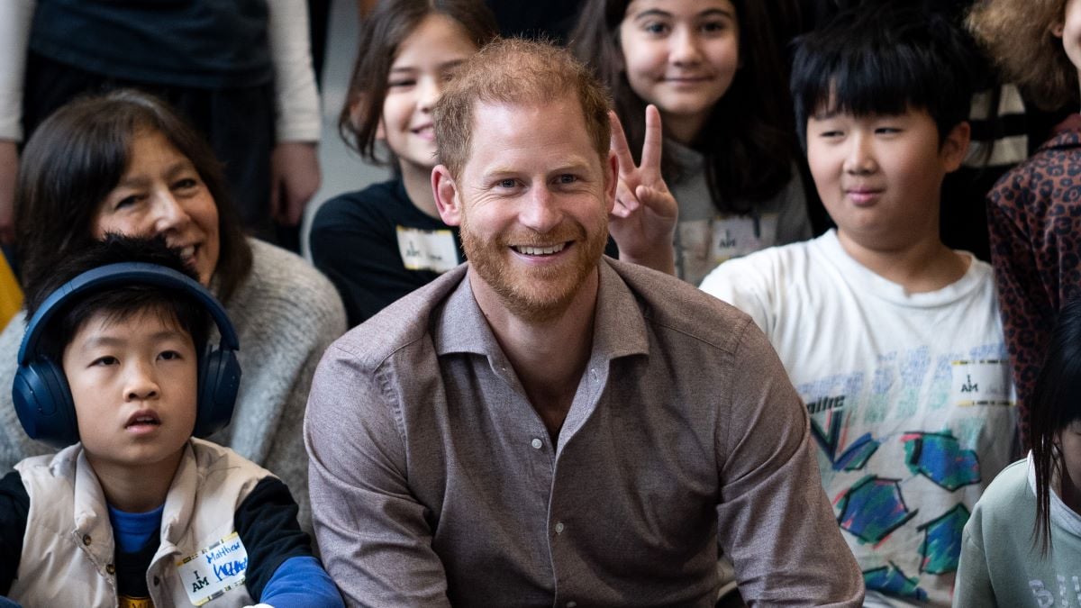 Prince Harry, the Duke of Sussex, poses for a photo with elementary school students during the Invictus Games 2025 School Program Launch Event at Seaforth Armoury on November 18, 2024 in Vancouver, Canada. (Photo by Ethan Cairns/Getty Images)