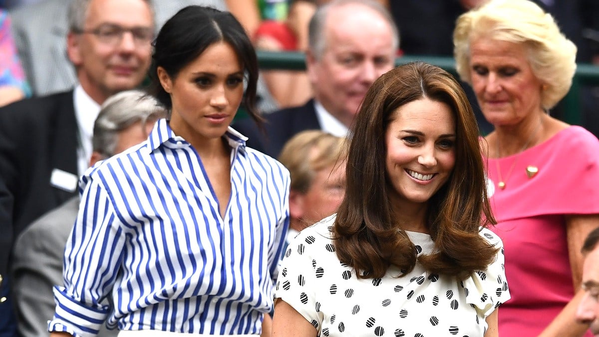 Meghan, Duchess of Sussex and Catherine, Duchess of Cambridge attend day twelve of the Wimbledon Lawn Tennis Championships at All England Lawn Tennis and Croquet Club on July 14, 2018 in London, England.