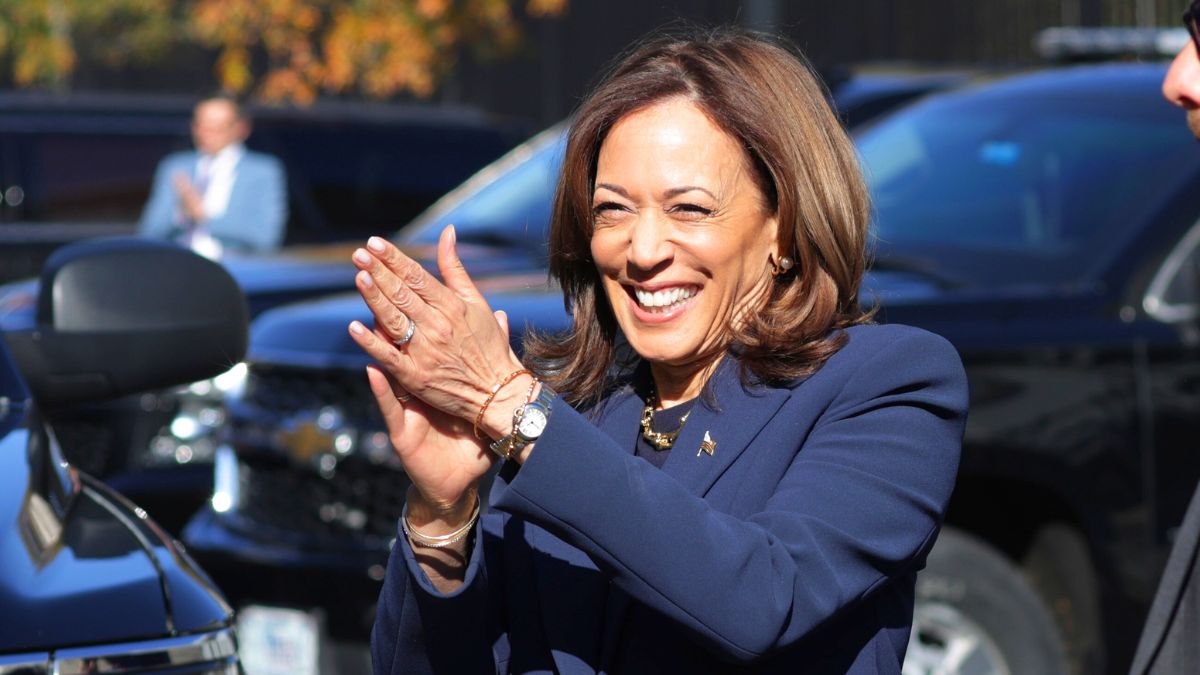 Kamala Harris greets White House staff as she returns to the White House