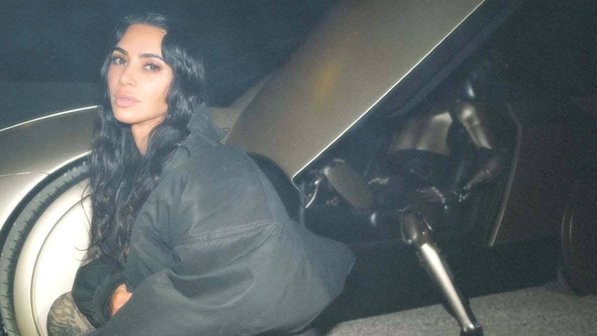 Kim Kardashian poses with a Tesla robot