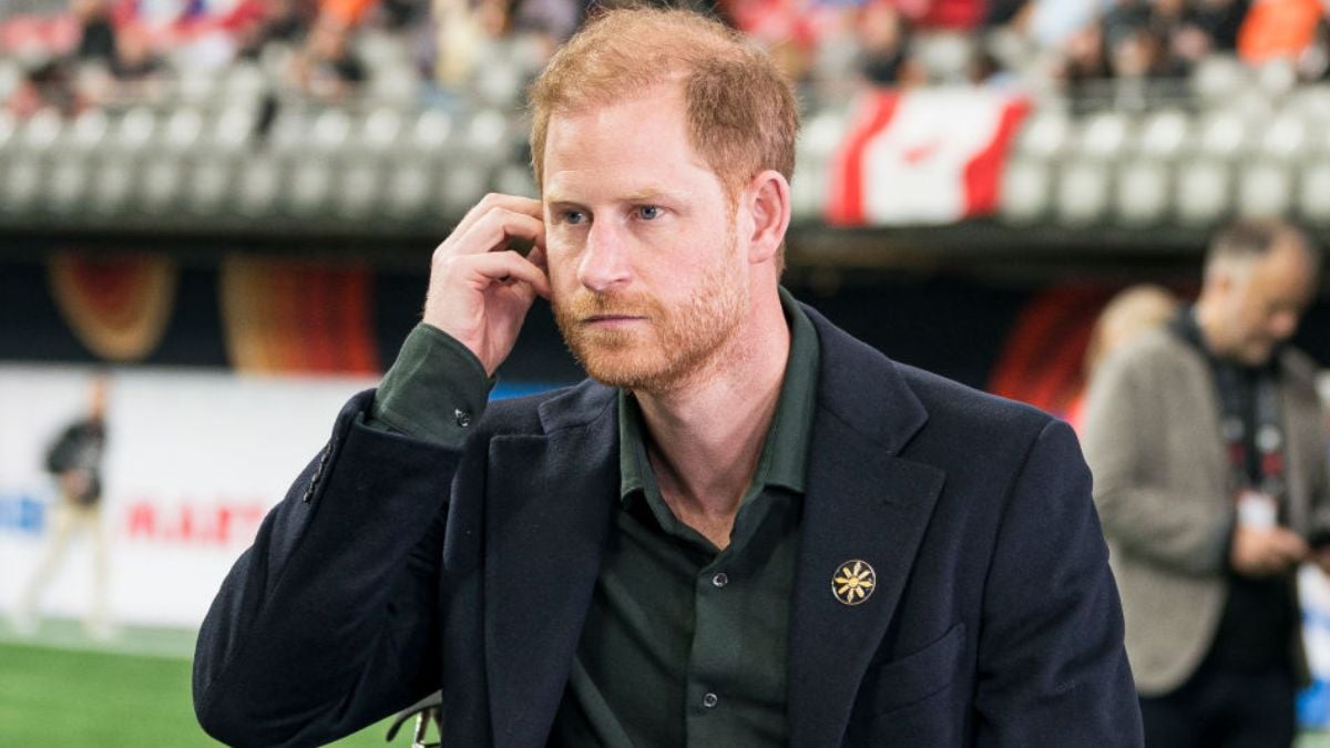 VANCOUVER, CANADA - NOVEMBER 17: Prince Harry adjusts his ear piece prior to the start of a TV interview during pre-game festivities before the start of the 2024 Grey Cup at BC Place on November 17, 2024 in Vancouver, Canada. (Photo by Rich Lam/Getty Images)