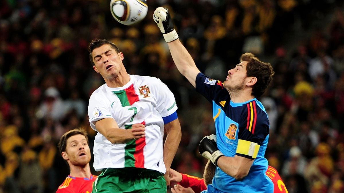 Iker Casillas of Spain defends an attack by Cristiano Ronaldo of Portugal during the 2010 FIFA World Cup South Africa Round of Sixteen match between Spain and Portugal at Green Point Stadium on June 29, 2010 in Cape Town, South Africa. 