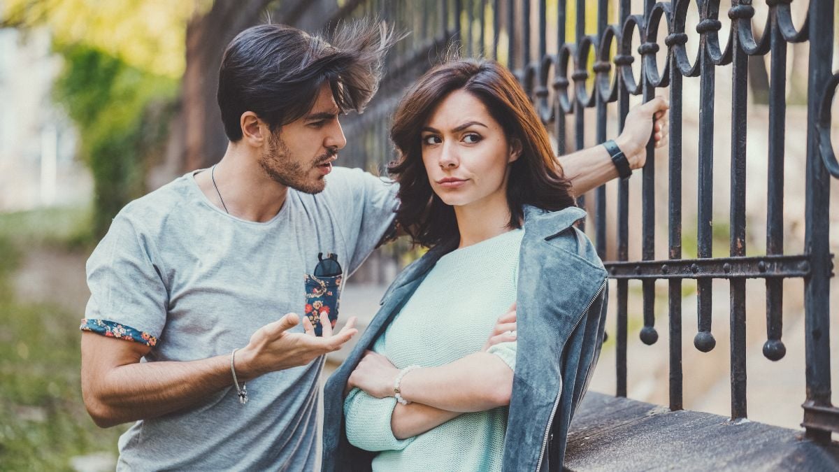 Unhappy couple outside talking about problems