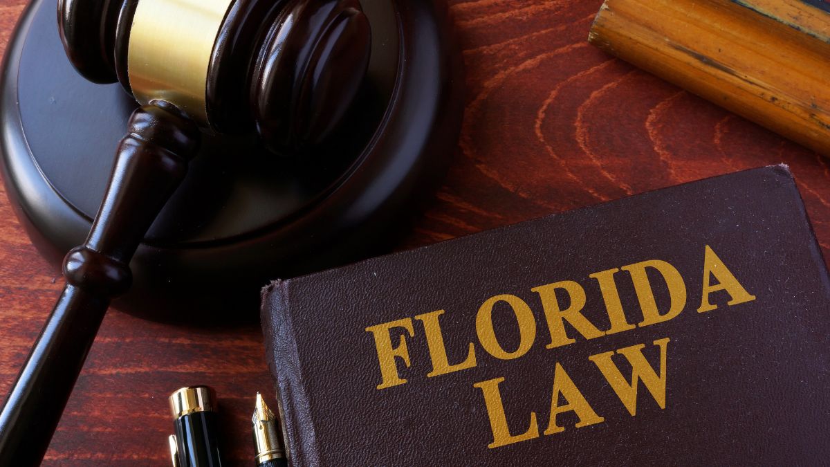 A gavel sits by a Florida Lawbook