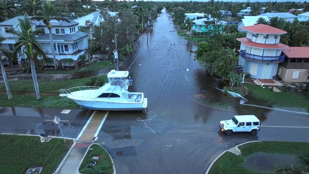 A yacht sitting in the middle of a Florida road