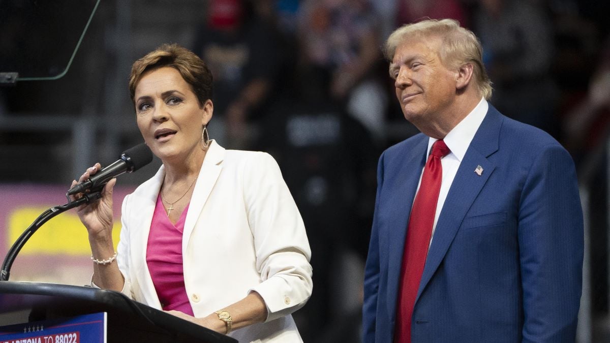 U.S. Republican presidential nominee, former President Donald Trump invites Arizona Republican U.S. Senate candidate Kari Lake on stage during a campaign rally at Findlay Toyota Center on October 13, 2024 in Prescott Valley, Arizona. With leaders of the Border Patrol union in attendance, Trump pledged to hire 10,000 additional border patrol agents if reelected, intensifying his attacks on Democratic opponent Kamala Harris on the issue. (Photo by Rebecca Noble/Getty Images)