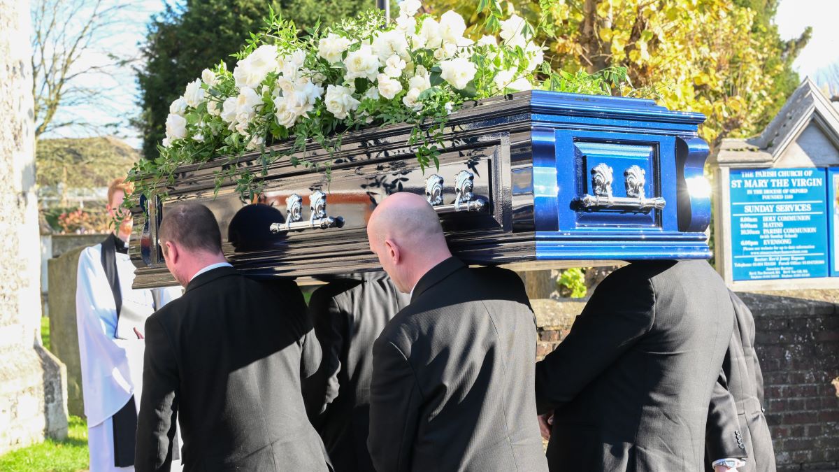 Pallbearers carry the coffin of former member of One Direction singer Liam Payne at his funeral on November 20, 2024 in Amersham, England. Former One Direction star Liam Payne's private funeral in Amersham has been widely anticipated to draw celebrities and fans alike, wishing to pay their final respects. The singer died after falling from a hotel balcony in Buenos Aires on October 16. (Photo by Karwai Tang/WireImage)