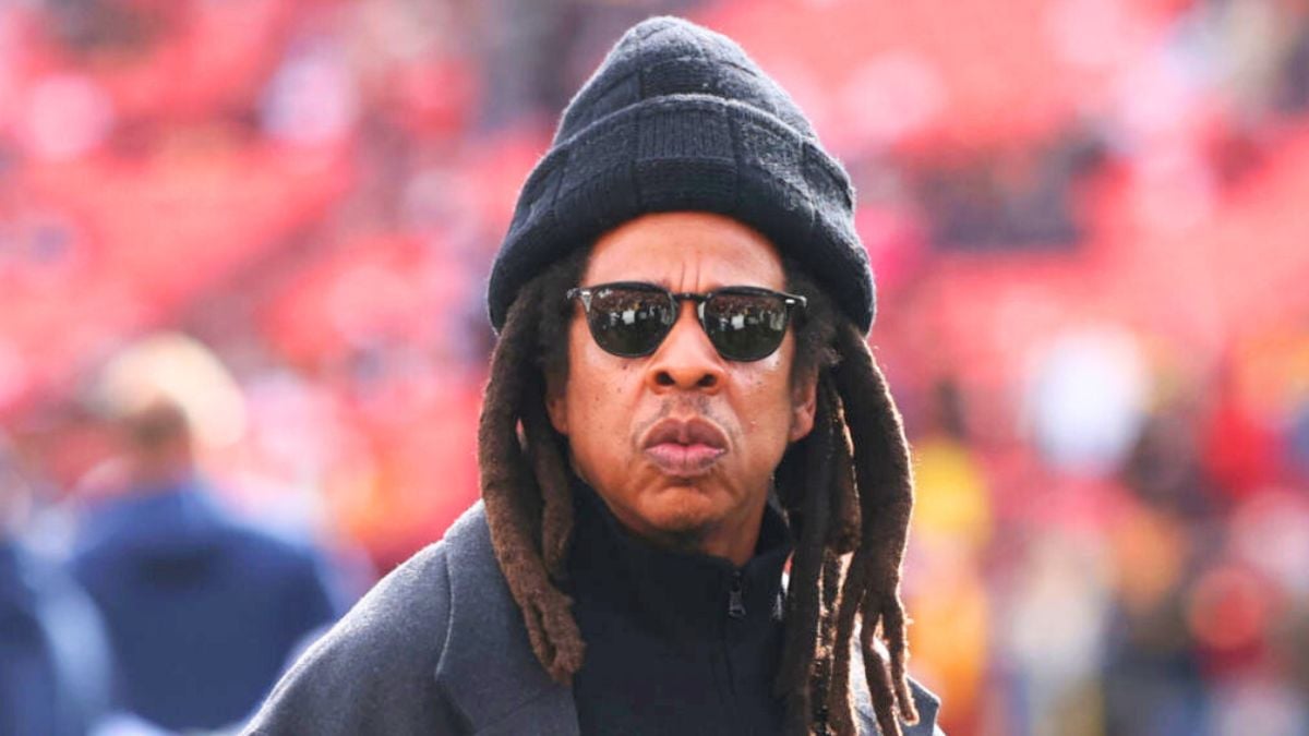 LANDOVER, MARYLAND - NOVEMBER 24: Rapper Jay-Z (C) looks on before a game between the Washington Commanders and the Dallas Cowboys at Northwest Stadium on November 24, 2024 in Landover, Maryland. (Photo by Timothy Nwachukwu/Getty Images)