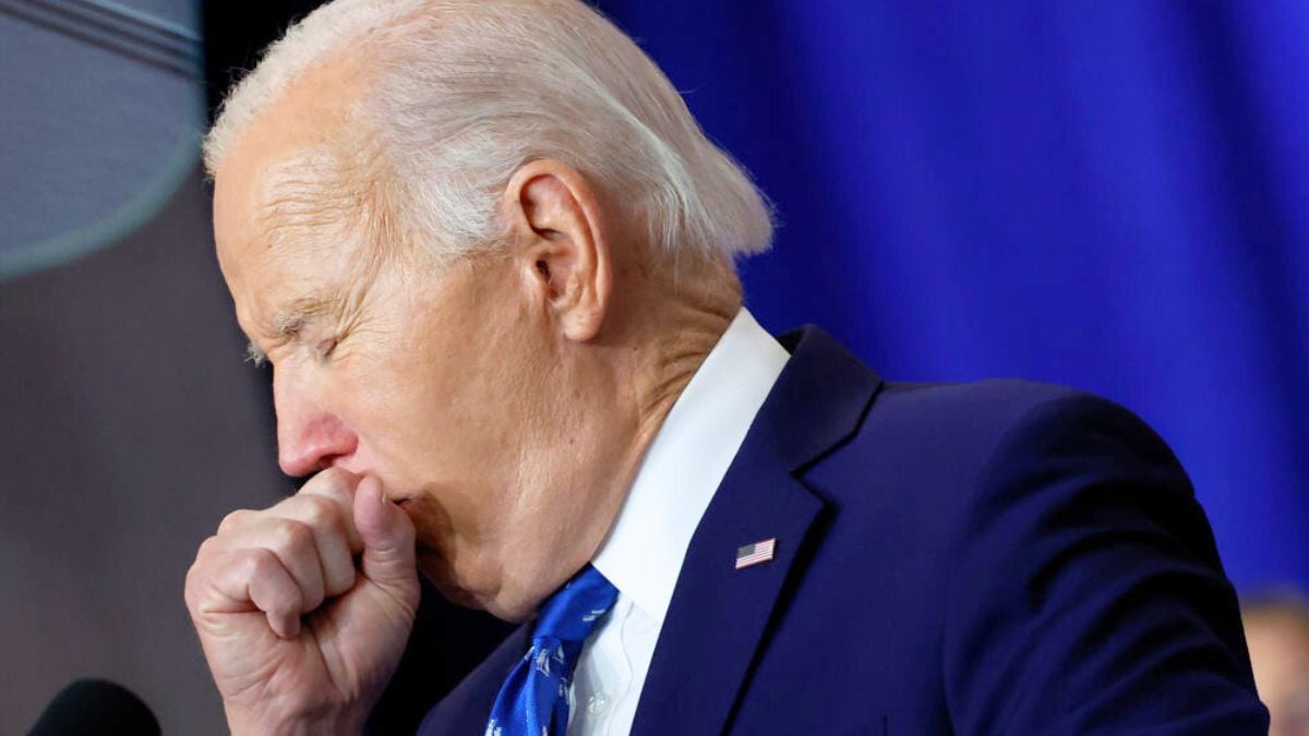 WASHINGTON, DC - DECEMBER 16: U.S. President Joe Biden coughs as he delivers remarks at the Department of Labor on December 16, 2024 in Washington, DC. Biden signed a proclamation to establish the Frances Perkins National Monument in Maine. Perkins was the first female Cabinet secretary and served as the Labor Secretary under Franklin Roosevelt. (Photo by Kevin Dietsch/Getty Images)