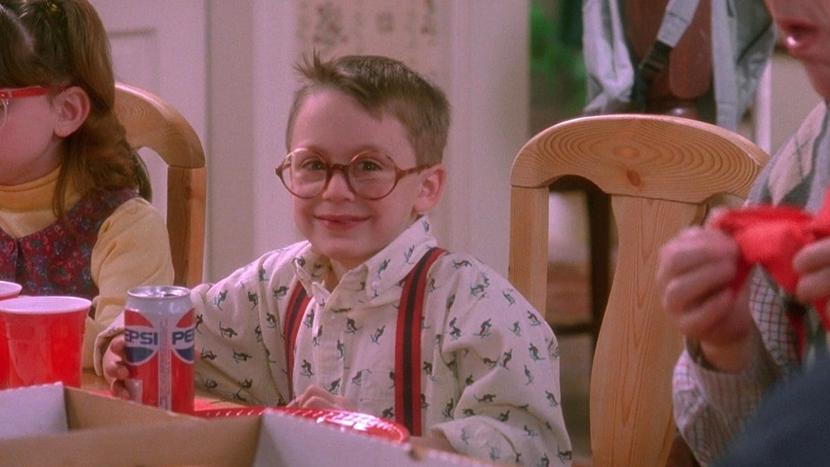 Kieran Culkin as Fuller McCallister smiling and drinking a Pepsi in Home Alone