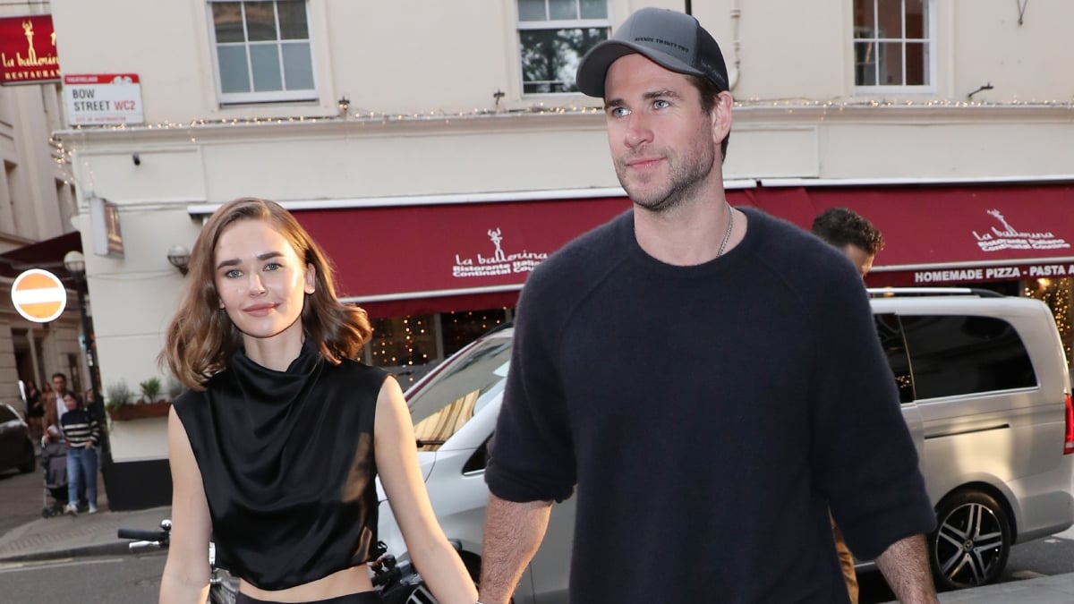 Liam Hemsworth and Gabriella Brooks arriving at a dinner for Furiosa: A Mad Max Saga on May 17, 2024 in London, England.